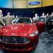 Members of the media get a closer look at Ford's all-new Fusion during a press conference to open up the North American International Auto Show in Detroit at Joe Louis Arena on Monday morning.  Melanie Maxwell I AnnArbor.com